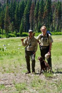 Two forest service employees with tools